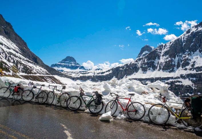Bike travel in National Parks: A car-free Going-to-the-Sun Road is the ride of a lifetime during Glacier Park's spring plowing. 
